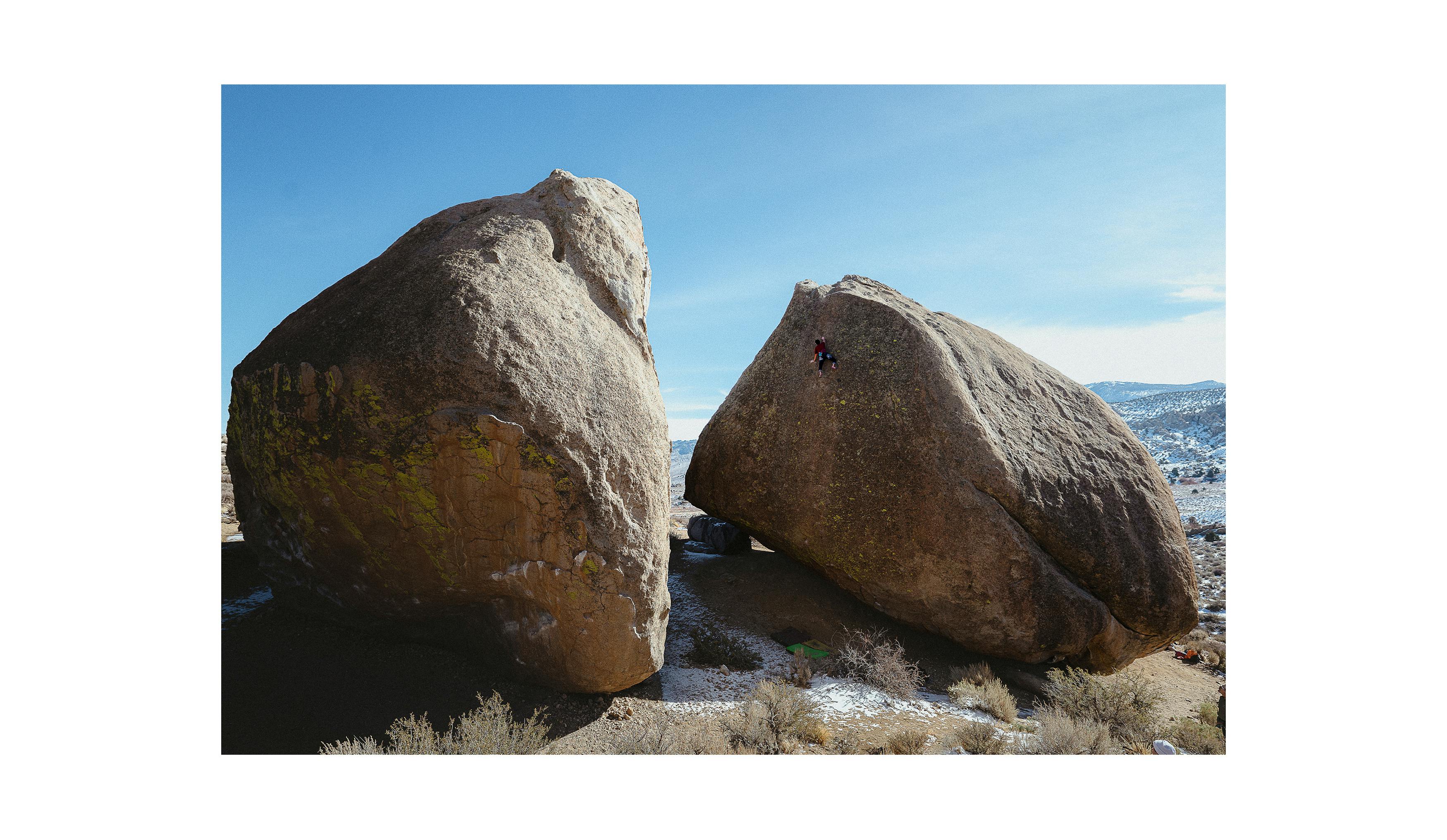 Timmy Kang climbing on a highball boulder in Bishop.