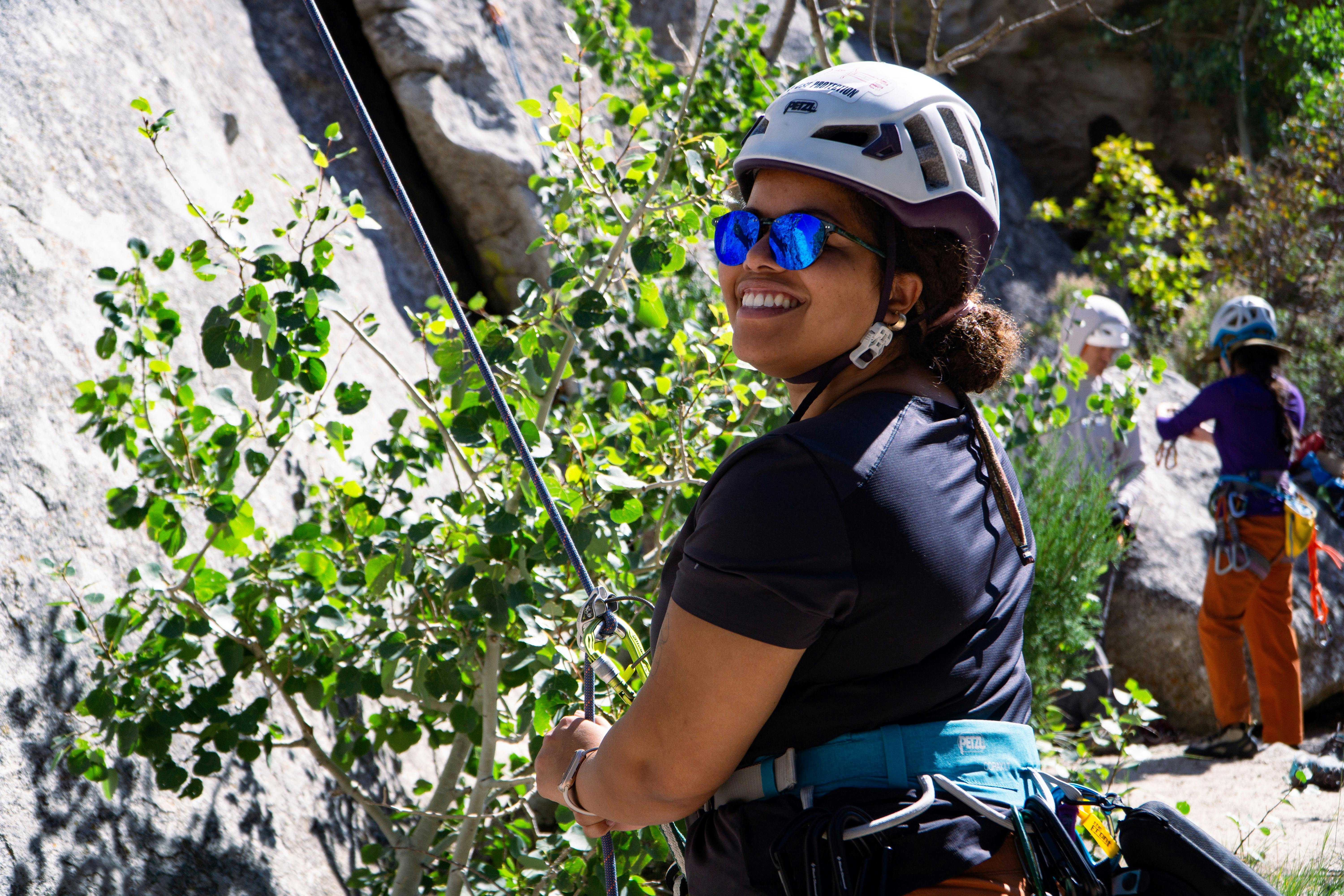 A climber belays a friend. 