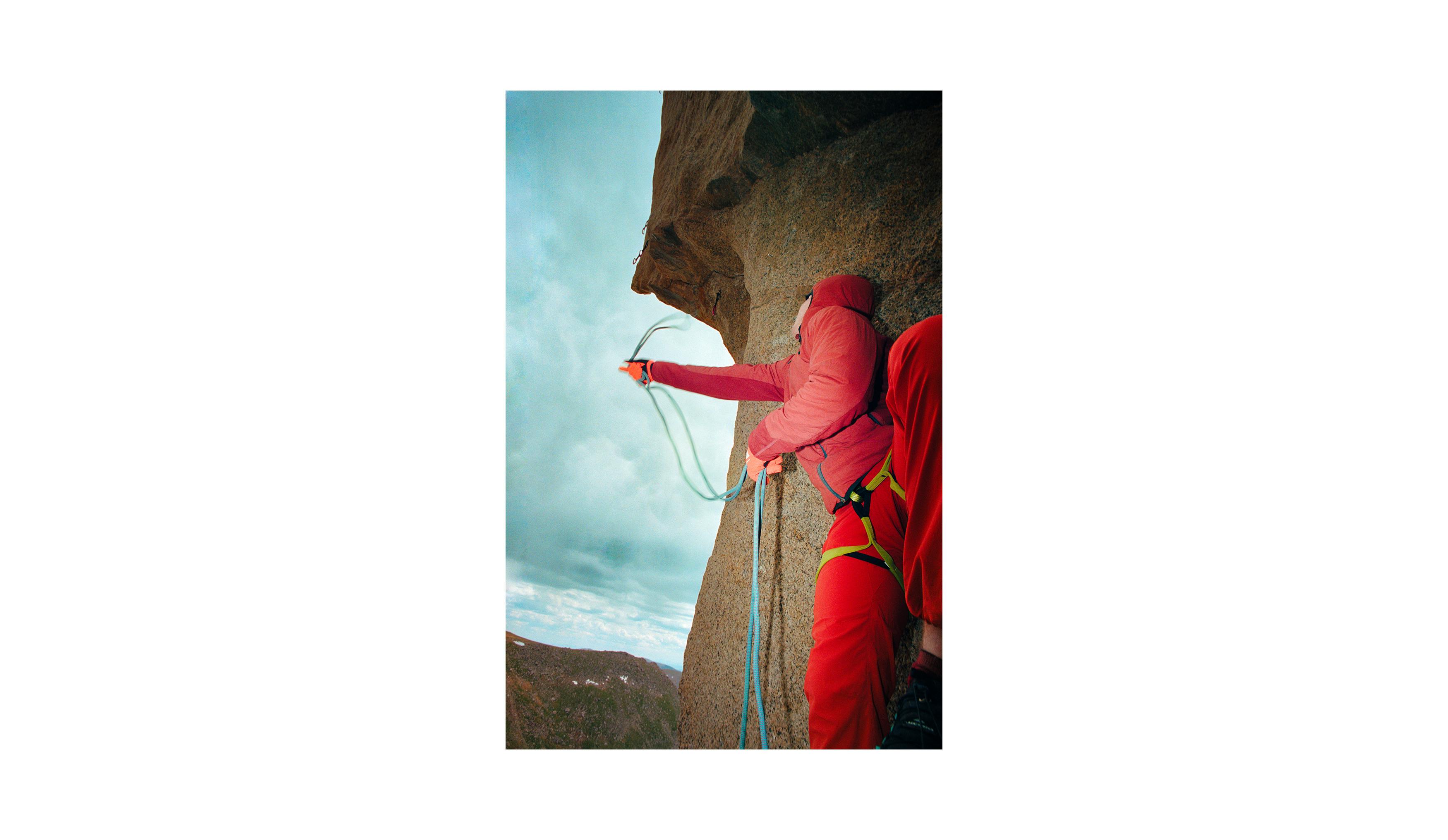 A climber whips a rope to clip the first draw