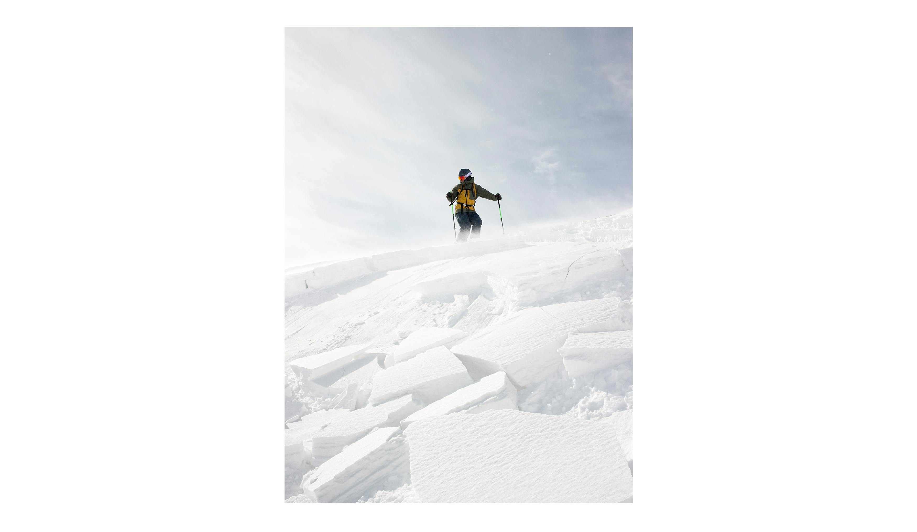 A backcountry skier triggers an avalanche with a ski cut. 